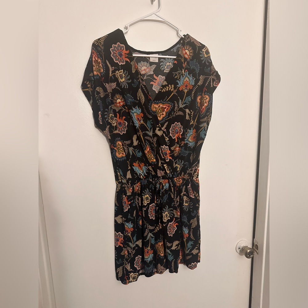 Short sleeve romper with pockets.